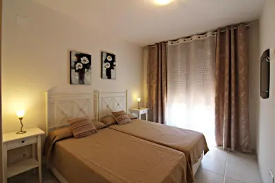 Cama o camas de una habitación en Altos de Nuevo Vera
