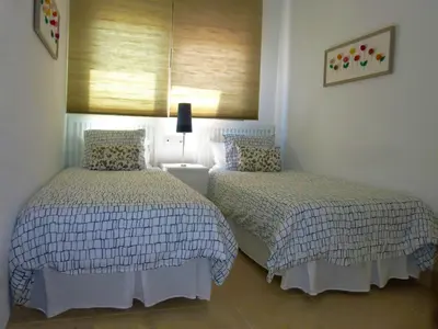 Cama o camas de una habitación en Apartamento con piscina