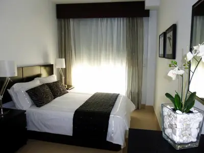 Cama o camas de una habitación en Apartamento con piscina