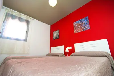 Cama o camas de una habitación en Apartamentos 16:9 Suites Almería