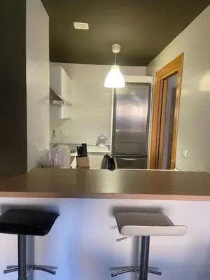 Una cocina o zona de cocina en Apartamentos 16:9 Suites Almería