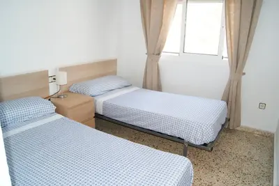 Cama o camas de una habitación en Playa Delicias
