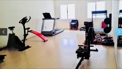 Gimnasio o instalaciones de fitness de ÁTICO DELUXE entre CENTRO y PLAYA Salinas con TERRAZA, WIFI, PISCINA climatizada, GYM, SAUNA y GARAJE -Smart TV