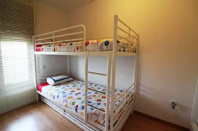 Cama o camas de una habitación en Apartamentos Alborada III