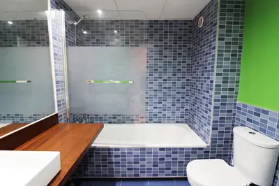 Un baño de Apartamentos Alborada III
