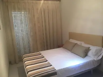 Cama o camas de una habitación en 1 Calle del Mar Apartamento