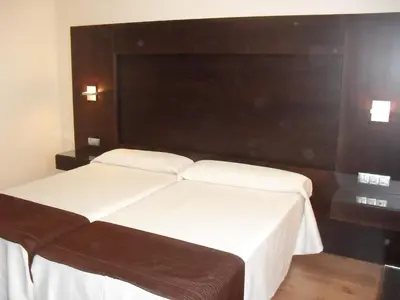 Cama o camas de una habitación en Hotel Anabel Baza