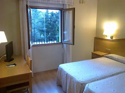 Cama o camas de una habitación en Hotel Anabel Baza