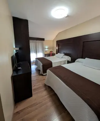 Cama o camas de una habitación en Hotel Anabel Baza