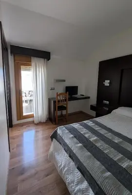 Cama o camas de una habitación en Hotel Anabel Baza