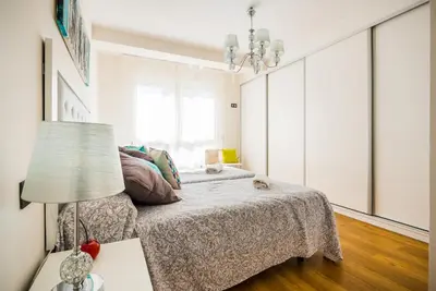 Cama o camas de una habitación en Expoholidays-Rueda Lopez apartamento de lujo