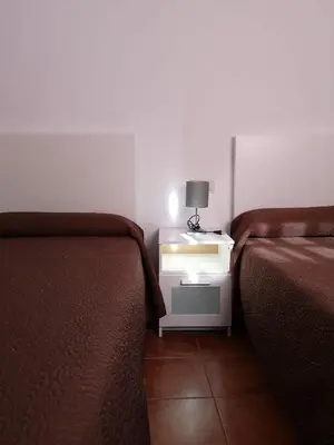 Cama o camas de una habitación en Apartamentos El Galán