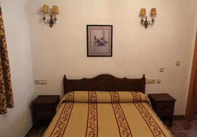 Cama o camas de una habitación en AT Restaurante El Palacil