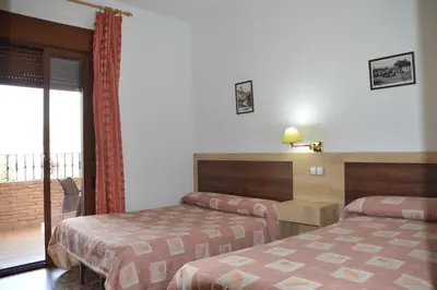 Cama o camas de una habitación en LABELLA - Hostal Rural Restaurante