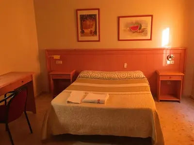 Cama o camas de una habitación en Hostal Carlos III