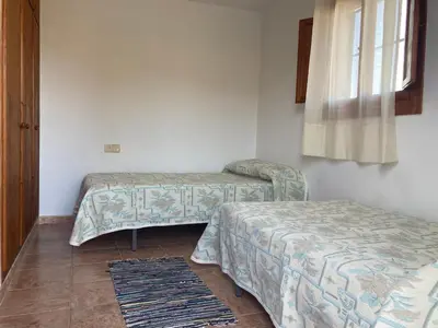 Cama o camas de una habitación en Cortijo Los Garridos - 12 huéspedes