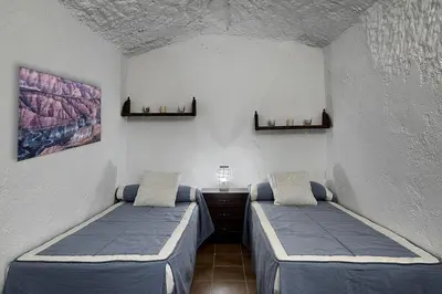 Cama o camas de una habitación en Cueva Alcázar