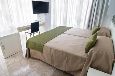 Cama o camas de una habitación en Hotel Senderos