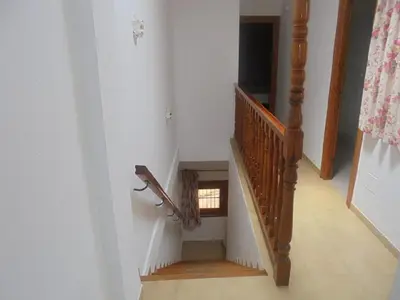 Una televisión o centro de entretenimiento en Apartamento en la Playa de San José-sjjc