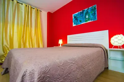 Cama o camas de una habitación en Apartamentos 16:9 Playa Suites