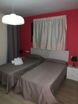 Cama o camas de una habitación en Apartamentos 16:9 Playa Suites