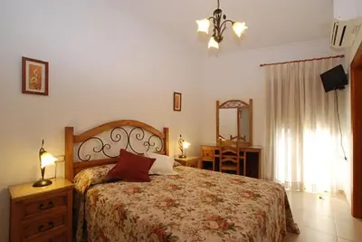 Cama o camas de una habitación en Hostal el Puente