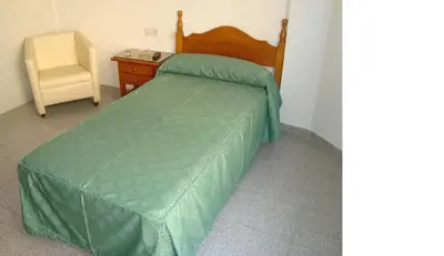Cama o camas de una habitación en Hostal Centro Ejido
