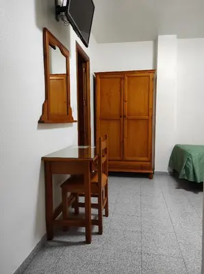 Una televisión o centro de entretenimiento en Hostal Centro Ejido