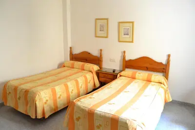 Cama o camas de una habitación en Hostal Centro Ejido