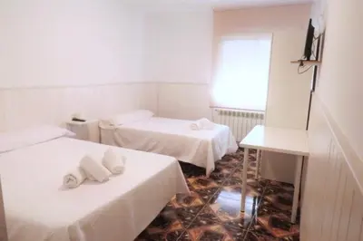 Cama o camas de una habitación en Hostal Jaufil