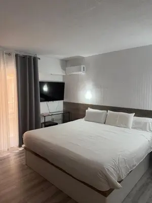 Cama o camas de una habitación en Hotel Carlos III