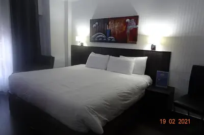 Cama o camas de una habitación en Hotel Carlos III
