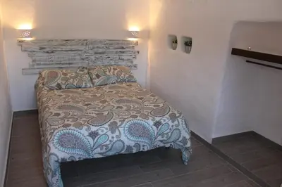 Cama o camas de una habitación en Cuevas Adonia