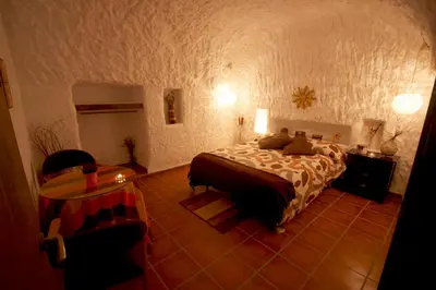 Cama o camas de una habitación en Cuevas Adonia