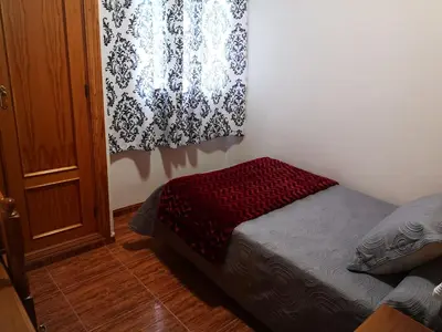 Cama o camas de una habitación en Hostal Los Hermanos