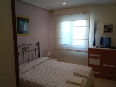 Cama o camas de una habitación en Apartamento Naturista con jardín Torremar Natura Junto a la playa