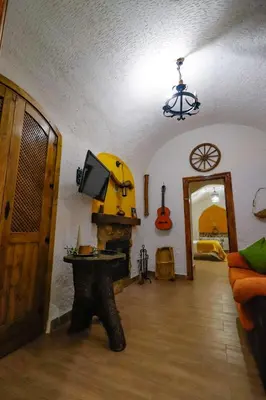 Una televisión o centro de entretenimiento en Cuevas Cortijo Gachas