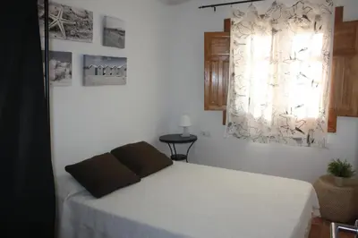 Cama o camas de una habitación en Casa cala del plomo
