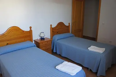 Cama o camas de una habitación en APARTAMENTOS ALBANTA