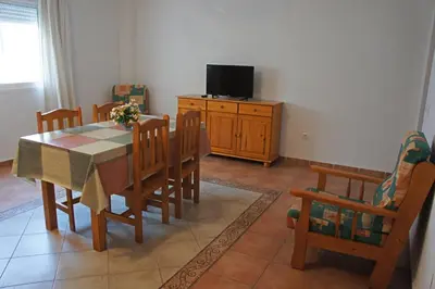 Una televisión o centro de entretenimiento en APARTAMENTOS ALBANTA