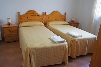 Cama o camas de una habitación en APARTAMENTOS ALBANTA