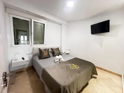 Cama o camas de una habitación en Rentaly Holidays Apartamento Playa Almeria