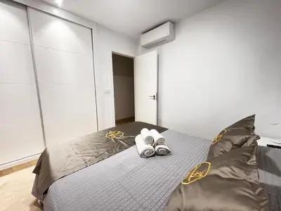 Cama o camas de una habitación en Rentaly Holidays Apartamento Playa Almeria