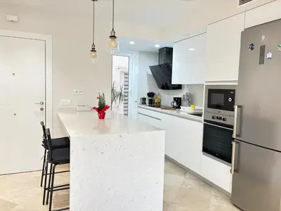 Una cocina o zona de cocina en Rentaly Holidays Apartamento Playa Almeria