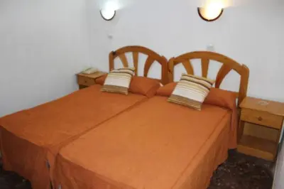 Cama o camas de una habitación en Pension Americano