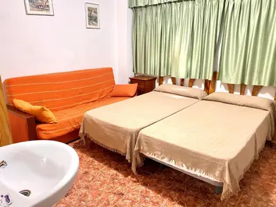 Cama o camas de una habitación en Pension Americano
