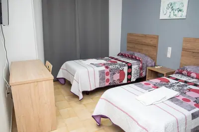 Cama o camas de una habitación en Pension Cuatro Vientos