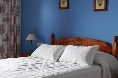 Cama o camas de una habitación en Hospedería Ancladero