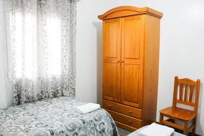 Cama o camas de una habitación en Apartamentos El Galán II