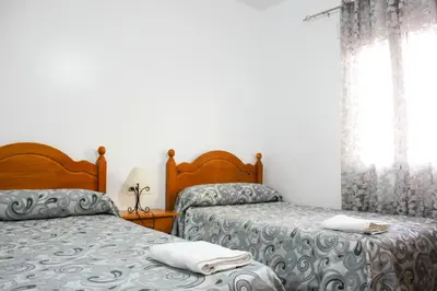 Cama o camas de una habitación en Apartamentos El Galán II